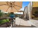 Spacious patio with seating area, umbrella, and artificial turf at 672 W 128Th Pl, Westminster, CO 80234