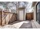 Fenced backyard with a storage shed and concrete patio, perfect for outdoor activities at 4634 S Fraser Ct # F, Aurora, CO 80015