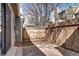 Rear view of a fenced in backyard with sliding glass doors leading indoors at 4634 S Fraser Ct # F, Aurora, CO 80015