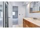 Bright bathroom vanity with tile flooring adjacent to a bedroom space at 4634 S Fraser Ct # F, Aurora, CO 80015