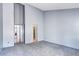 Spacious bedroom with neutral carpeting, high ceilings, and ample natural light at 4634 S Fraser Ct # F, Aurora, CO 80015