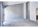 Spacious bedroom with neutral carpet, a sliding glass door, and an attached bathroom at 4634 S Fraser Ct # F, Aurora, CO 80015