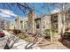 Townhome featuring neutral siding, multiple windows, and shade trees at 4634 S Fraser Ct # F, Aurora, CO 80015