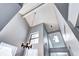 View of the foyer with vaulted ceilings, a skylight, and a hanging candle chandelier at 4634 S Fraser Ct # F, Aurora, CO 80015