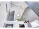 View of the foyer with vaulted ceilings, a skylight, and a hanging candle chandelier at 4634 S Fraser Ct # F, Aurora, CO 80015