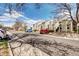 Street view showing multiple townhomes with nearby street parking on a sunny day at 4634 S Fraser Ct # F, Aurora, CO 80015