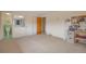 Large bedroom with carpeted floors, ample closet space, and a view of the en-suite bathroom at 6101 E 3Rd Ave, Denver, CO 80220