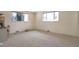 Bedroom featuring carpeted floors and large windows providing natural light at 6101 E 3Rd Ave, Denver, CO 80220