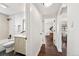 Bright bathroom featuring a stylish vanity, shower-over-tub with tile surround, and modern fixtures at 4250 Marshall St, Wheat Ridge, CO 80033