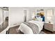 Bright bedroom featuring a comfortable bed, natural light, and view to hall and closet at 4250 Marshall St, Wheat Ridge, CO 80033