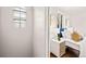 Bedroom featuring a comfortable bed, natural light, and stylish nightstand at 4250 Marshall St, Wheat Ridge, CO 80033