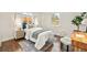 Cozy bedroom with a comfortable bed, natural light, and a charming accent rug at 4250 Marshall St, Wheat Ridge, CO 80033
