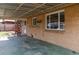 The covered patio features solid surface flooring and provides additional sheltered outdoor space at 4250 Marshall St, Wheat Ridge, CO 80033