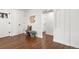 Hallway featuring dark hardwood flooring, white walls, and minimalist decor at 4250 Marshall St, Wheat Ridge, CO 80033