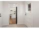 Hallway to kitchen area features neutral colors and lots of natural light at 4250 Marshall St, Wheat Ridge, CO 80033