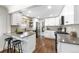 Bright renovated kitchen featuring gray countertops and stainless steel appliances at 4250 Marshall St, Wheat Ridge, CO 80033