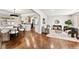Open-concept living area with hardwood floors connecting kitchen and living spaces at 4250 Marshall St, Wheat Ridge, CO 80033