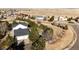 A picturesque aerial view of a home nestled in a serene neighborhood setting at 935 Green Gables Cir, Bennett, CO 80102