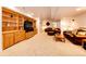Basement with custom wood built-ins and entertainment area at 935 Green Gables Cir, Bennett, CO 80102