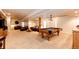Large basement with pool table, entertainment area, and recessed lighting at 935 Green Gables Cir, Bennett, CO 80102