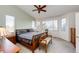 Inviting bedroom with large bay windows providing natural light and wooden accents at 935 Green Gables Cir, Bennett, CO 80102