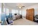 Charming bedroom with a large bay window and built-in storage at 935 Green Gables Cir, Bennett, CO 80102