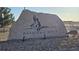 Entrance sign to Antelope Hills community featuring a stone monument and landscaping at 935 Green Gables Cir, Bennett, CO 80102