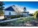 Stunning home with lush landscaping, brick accents, and a charming covered porch at 935 Green Gables Cir, Bennett, CO 80102
