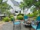 Backyard fire pit area with comfortable seating and natural landscaping at 935 Green Gables Cir, Bennett, CO 80102