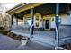 Inviting front porch with ample space and charming details at 935 Green Gables Cir, Bennett, CO 80102