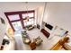 Bright living room with fireplace, high ceilings, large windows, and glass doors to the outside at 935 Green Gables Cir, Bennett, CO 80102