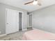 Bright bedroom with a ceiling fan and closet offering ample storage space at 159 Judson St, Longmont, CO 80501
