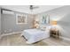Bright bedroom with modern ceiling fan, hardwood style floors, and contemporary decor at 159 Judson St, Longmont, CO 80501
