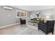 Bright living room featuring modern decor, hardwood style floors and plenty of natural light at 159 Judson St, Longmont, CO 80501