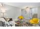 Comfortable living room with modern furniture, a decorative rug, and easy access to the staircase at 159 Judson St, Longmont, CO 80501