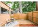 Cozy backyard featuring a privacy fence, a small patio, and a seating area at 1767 N Washington St, Denver, CO 80203