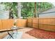 Charming backyard featuring privacy fence, patio, mulch, and seating area for relaxing outdoors at 1767 N Washington St, Denver, CO 80203