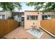 Small backyard featuring privacy fence, brick patio, and outdoor seating area at 1767 N Washington St, Denver, CO 80203