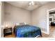 Cozy bedroom with hardwood floors, a nightstand, and a comfortable bed at 1767 N Washington St, Denver, CO 80203