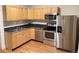 Modern kitchen with stainless steel appliances, ample cabinets, and a sleek design at 1767 N Washington St, Denver, CO 80203
