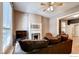 Inviting living room with a decorative fireplace, comfortable couch, and natural light at 1767 N Washington St, Denver, CO 80203