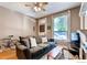 Relaxing living room features a comfortable sofa, natural light, and stylish accents at 1767 N Washington St, Denver, CO 80203