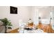 Bright office with french doors, a modern desk, a cowhide rug, hardwood floors and neutral paint at 1767 N Washington St, Denver, CO 80203