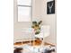 Bright office with a modern desk, a cowhide rug, hardwood floors, neutral paint and a large window at 1767 N Washington St, Denver, CO 80203