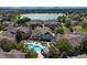 Aerial view of community showcasing a pool, lake, and surrounding residences at 12961 Lafayette St # B, Thornton, CO 80241