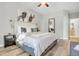 Bright bedroom with a king-size bed and hardwood floors at 12961 Lafayette St # B, Thornton, CO 80241