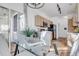 Dining area with stainless steel appliances, hardwood floors, and kitchen access at 12961 Lafayette St # B, Thornton, CO 80241