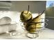 Closeup of kitchen counter with decorative fruit bowl at 12961 Lafayette St # B, Thornton, CO 80241