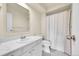 Well-lit bathroom features a shower-tub, and a sink with modern fixtures at 6980 E Girard Ave # 204, Denver, CO 80224