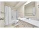 Bathroom with shower-tub combination, grab bar, and modern vanity at 6980 E Girard Ave # 204, Denver, CO 80224